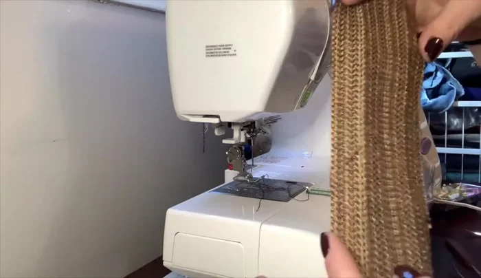 Create tabs for D-rings: Iron, fold, and top stitch.