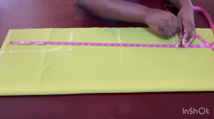 Mark dots for the dart; the top dot reaches the chest line, and the bottom dot stops 2 inches before the hip line.