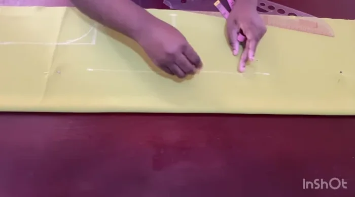 Mark dots for the dart; the top dot reaches the chest line, and the bottom dot stops 2 inches before the hip line.