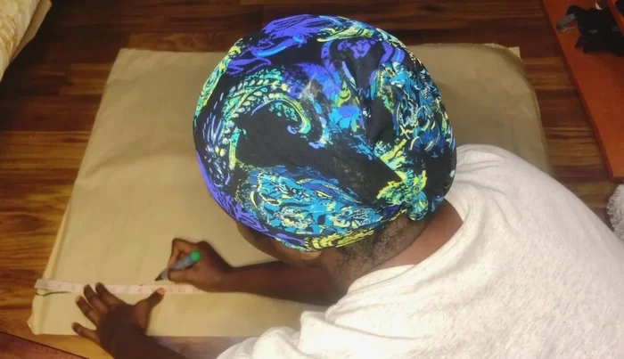 Connect the hip measurement points to the full skirt length to create the A-line flare. Cut the pencil skirt shape from the fabric, then add the flare later.