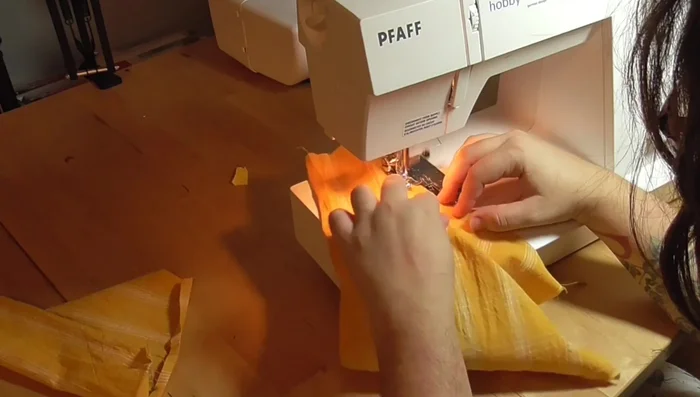 Sew side seams together, including pockets.