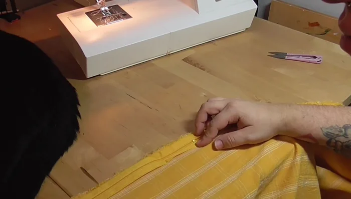 Sew side seams together, including pockets.