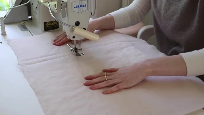 Cut out the quilted fabric using pattern piece A as a template. Mark the notches.