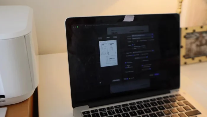 Construct the pattern by trimming and assembling the printed pages, ensuring registration marks align. Use a glue stick and clear tape to secure the seams.