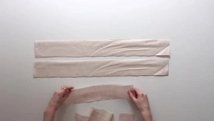 Sew the side and bottom seams of the lining pieces, leaving a gap for turning. Fold out the bottom corners and stitch across.