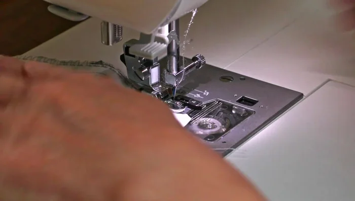 Sew around the edges of your seams, ensuring the stitch goes just over the fabric edge.