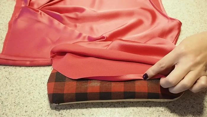 Hem the sleeves: Create a double rolled hem on the sleeves by pressing up the hem allowance twice, stitching close to the crease each time.