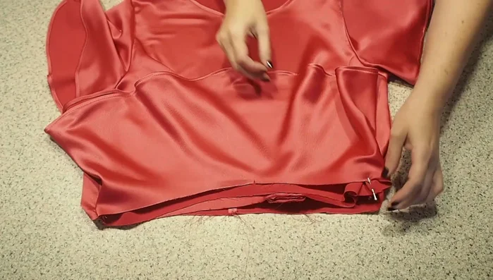 Attach the peplum: Pin and sew the peplum to the bodice waistline.