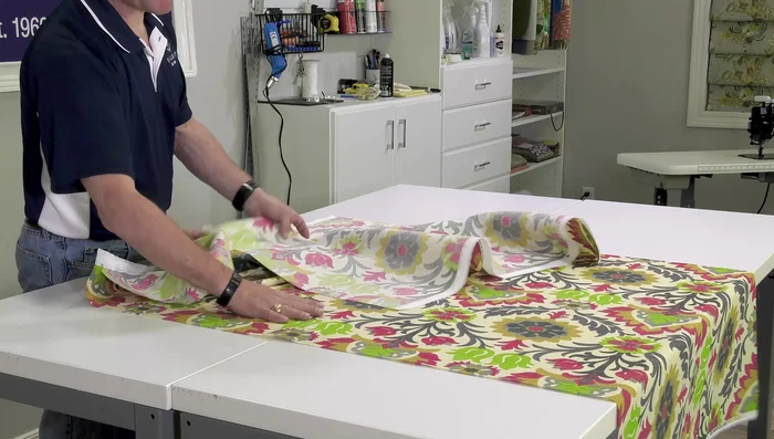 Finish the seam: Remove pins. Press the seam open with an iron using appropriate settings for your fabric type, checking for any recommended settings to avoid damage to the fabric.