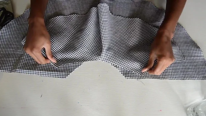 Attach the sleeve trumpet to the sleeve opening using a zig-zag stitch.