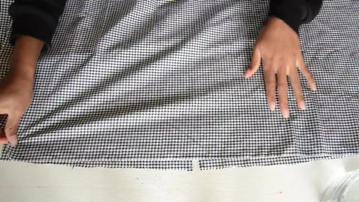 Attach the sleeves to the armholes of the blouse.