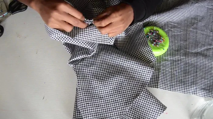 Attach the sleeves to the armholes of the blouse.