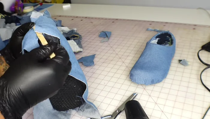 Apply a base layer of denim, stretching it as you glue to ensure a smooth finish.