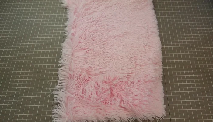 Brush the fabric to determine the nap direction. Cut pattern pieces ensuring all nap directions are consistent.