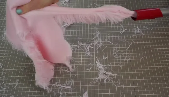 Cut the fabric. Use a vacuum hose to clean up excess fur.