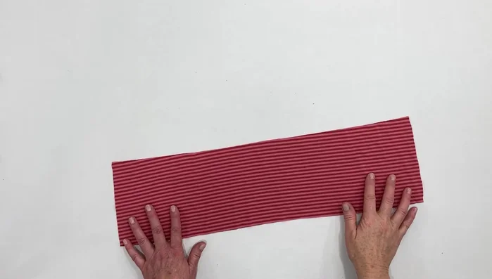 Cut a fabric strip equal to the head circumference and 6 inches wide (adjust for fabric stretch).