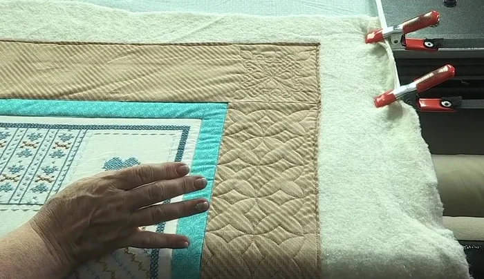 Draw boundaries around the quilt's borders using the machine's digitizing tools. This helps to ensure accurate stitching and allows for visual checking of any inconsistencies in the quilt's shape.