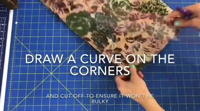 Fold fabric in half, curve the corners using a ruler or curved object, and cut to reduce bulk.