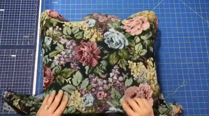 Fold fabric in half, curve the corners using a ruler or curved object, and cut to reduce bulk.