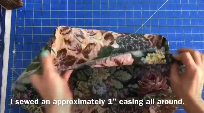 Create a one-inch casing around the serged edge and sew, leaving a gap for the drawstring.