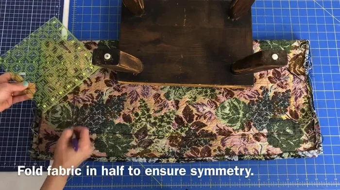 Fold fabric in half, curve the corners using a ruler or curved object, and cut to reduce bulk.
