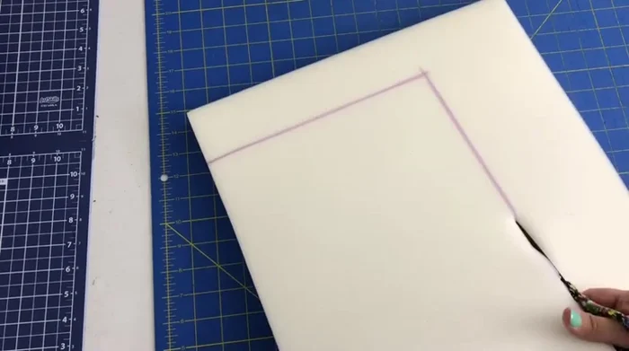 Cut out foam to fit the stool.