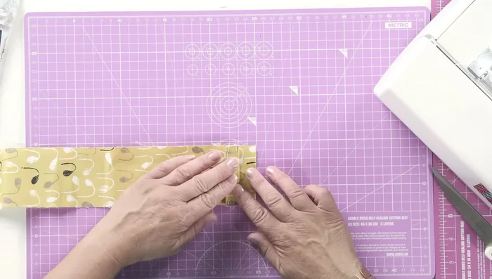 Sew the closure strip in place with a few stitches.