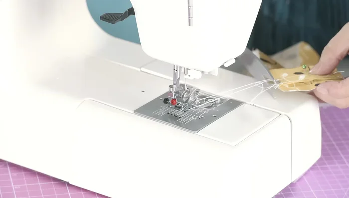 Sew the closure strip in place with a few stitches.