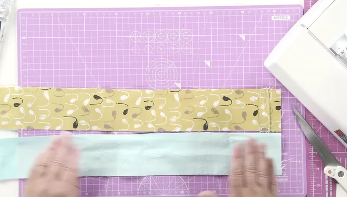 Sew the closure strip in place with a few stitches.