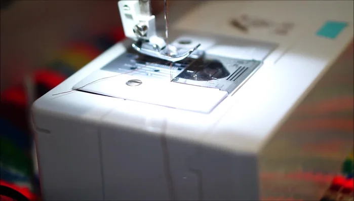 Attach the pit to the lighter green fabric using a sewing machine (or hand sewing/fabric glue). Leave a small gap at the top.