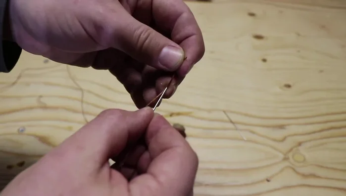 Hand stitch the belt: Using the saddle stitch technique, consistently pass the needle through the holes, ensuring the thread on the right-hand side goes over the needle with each stitch. Pull the threads tightly after each stitch.