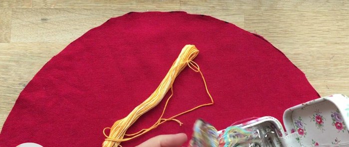 Optional: Sew on seed embellishments. Alternatively, draw seeds on with a pen.