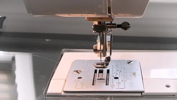 Drop the feed dogs: This gives you complete control over the fabric movement during free motion quilting. Consult your sewing machine manual for instructions.