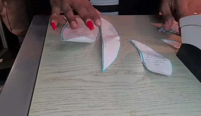 Prepare the pattern pieces: Cut out two pieces each for the body (front and back), arms, feet, and beak following the pattern.