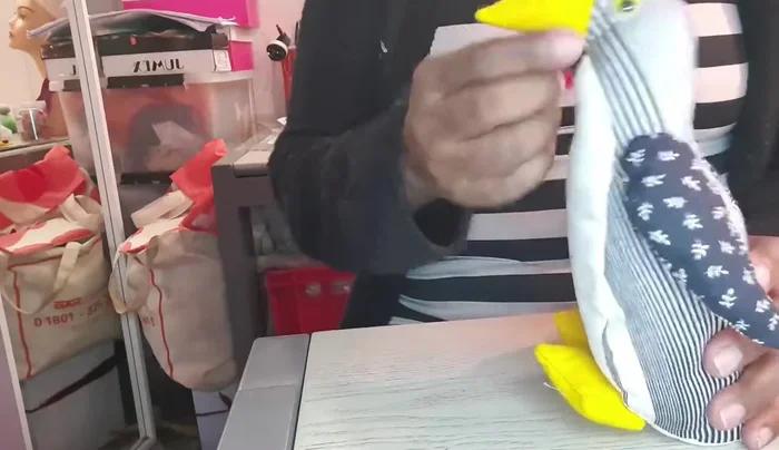 Add finishing touches: Attach eyes and beak.