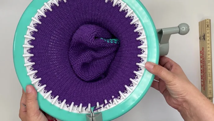 Cut waste yarn and remove from the machine.