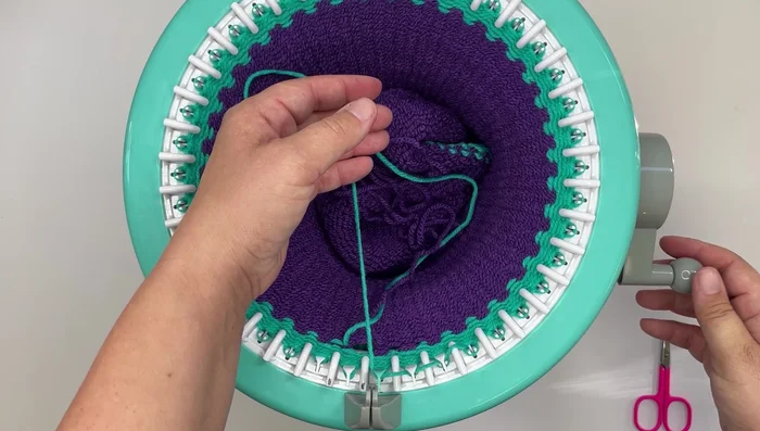 Cut waste yarn and remove from the machine.
