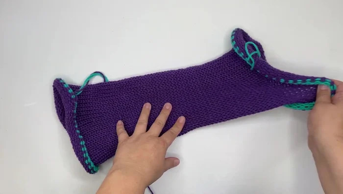 Using a crochet hook, slip stitch the two ends of the tube together to close it.