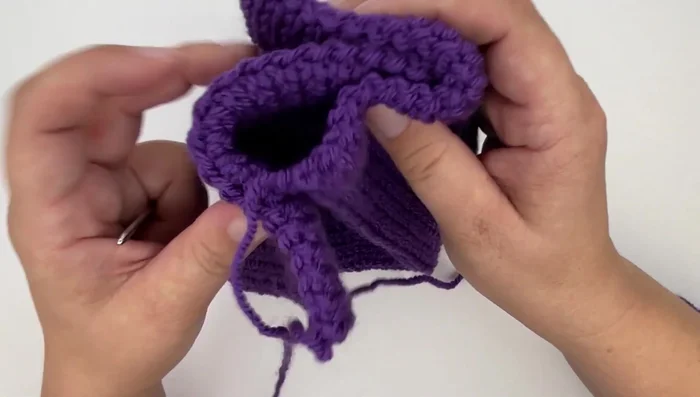 Fold each end of the tube in half and sandwich them together, with the ends facing outwards.