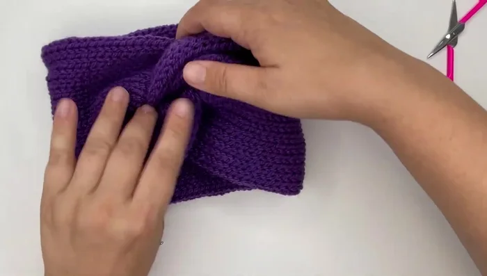 Turn the headband over and adjust for a final twisted look.