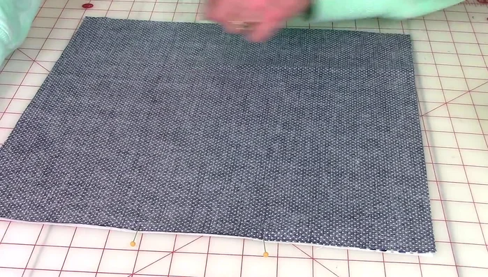 Stitch a 1/4-inch seam allowance around all four sides, leaving the opening unsewn. Use back stitches at the beginning and end, and pivot at the corners for neat seams.