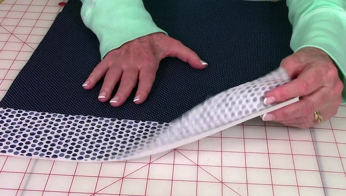 Fuse interfacing to the wrong side of one fabric piece.