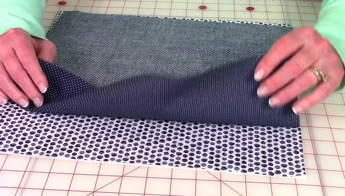 Stitch a 1/4-inch seam allowance around all four sides, leaving the opening unsewn. Use back stitches at the beginning and end, and pivot at the corners for neat seams.