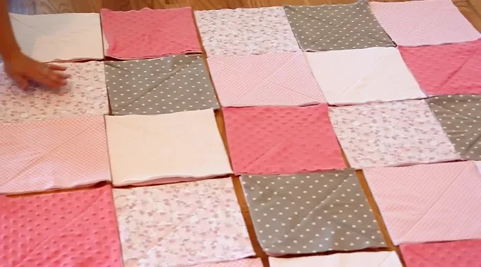 Sew rows together, aligning corners and pinning before stitching. Use a 3/4 inch seam allowance for more fluffiness.