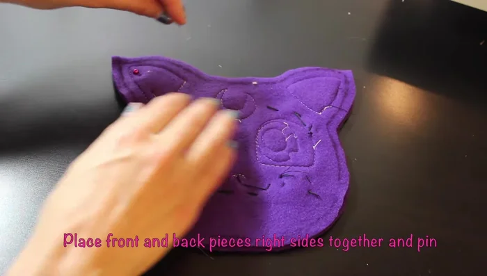Sew around the pinned line, leaving a hole to turn the plushie right side out, stuff it, and sew the hole closed.