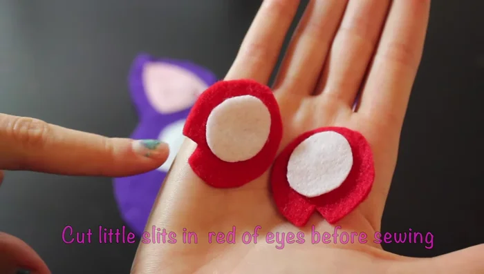Before sewing on the red circles for the eyes, cut little triangular slits on either end.