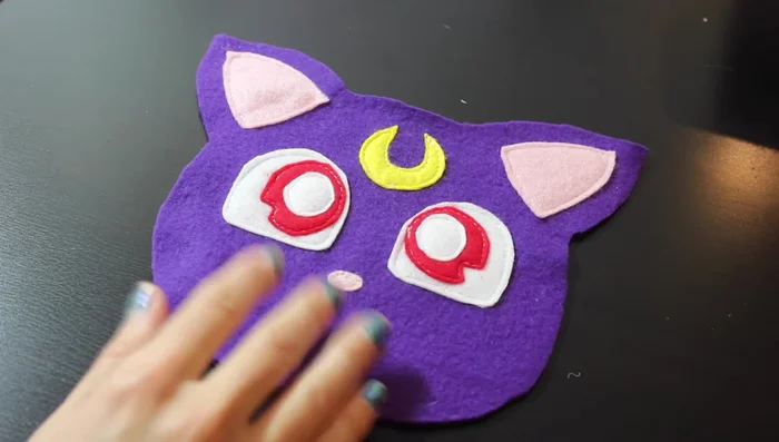 Sew all felt details in place.