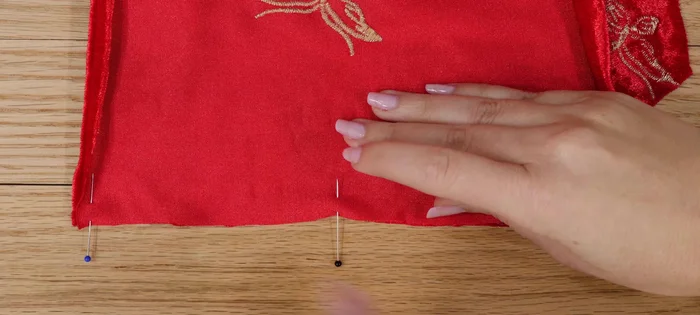 When pinning seams, use many straight pins or fabric clips within the seam allowance to avoid damaging the fabric.