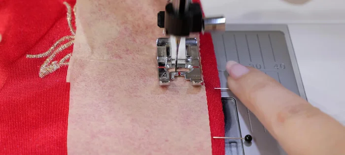 If fabric is difficult to feed, use tissue paper on top.