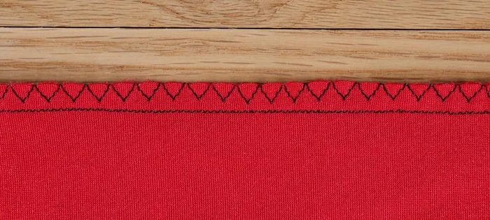 Finish seams using a serger, overcast stitch, or pinking shears.